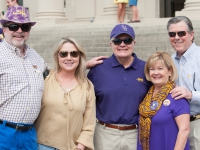 A group of people pose for a photo on the front steps of the LSU Law Center